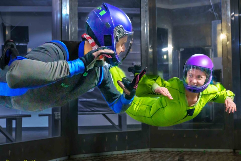 indoor skydiving Skydive Perris an instructor and solo skydiving student fly in the indoor skydiving wind tunnel