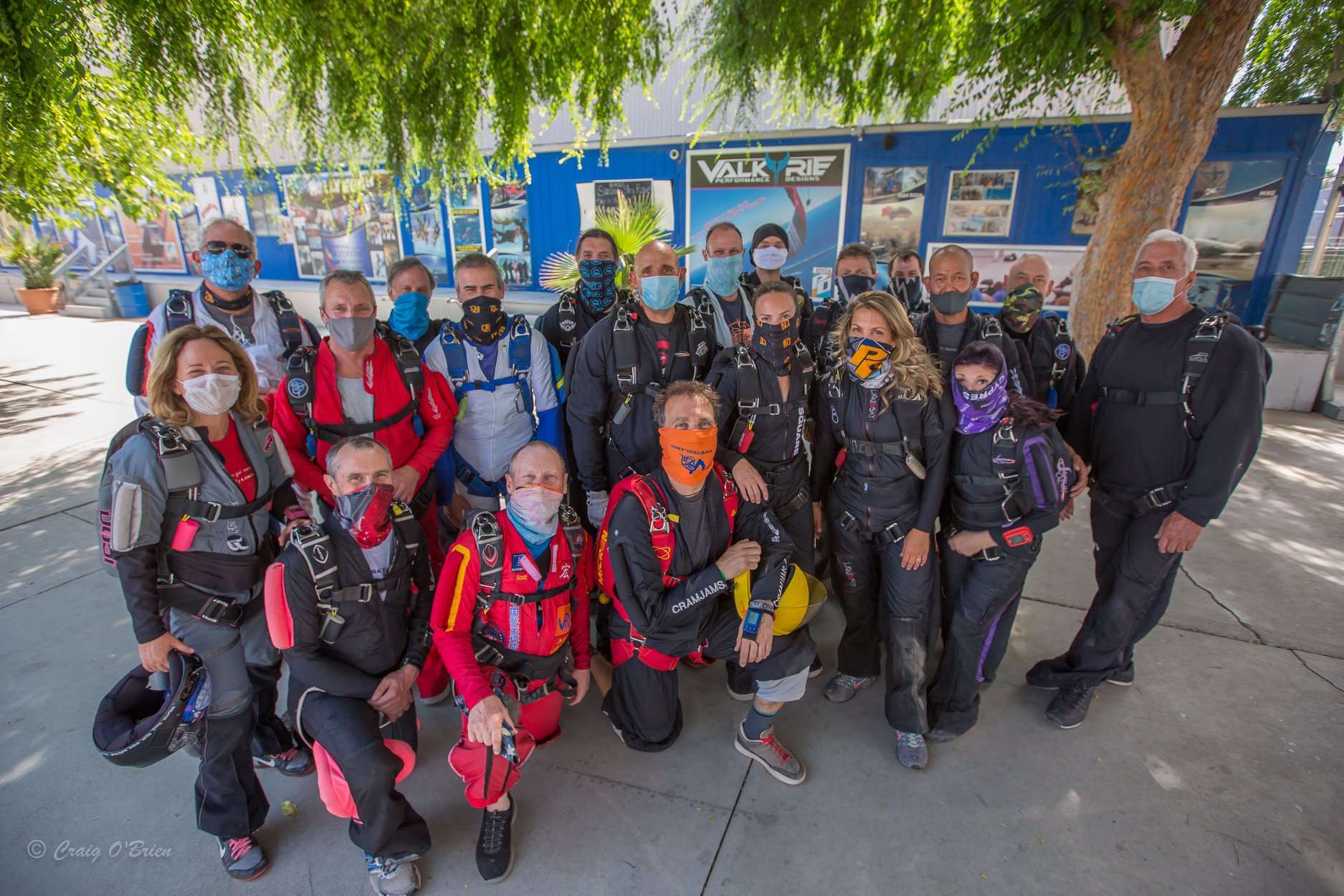 A group of skydivers work together during COVID-19.
