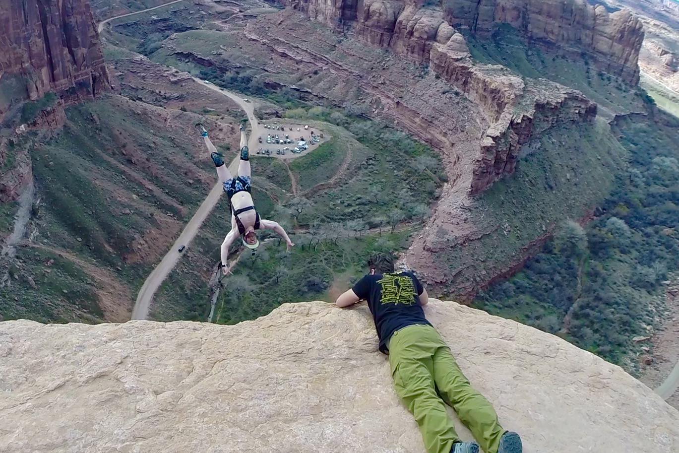 dan dupuis photographs base jumper off of cliff