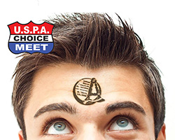 young man with blue eyes looks up towards A-license stamp on his forehead