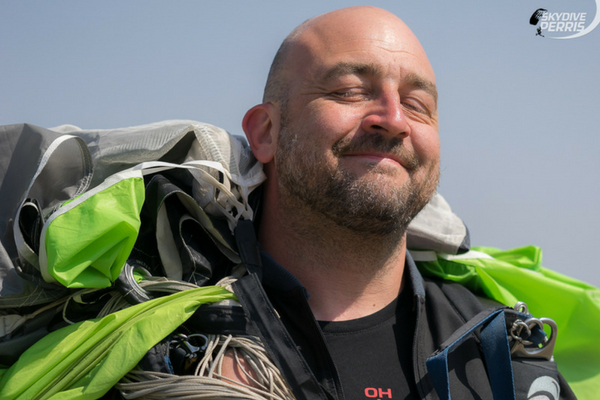 fun jumper smiles with eyes closed after a jump