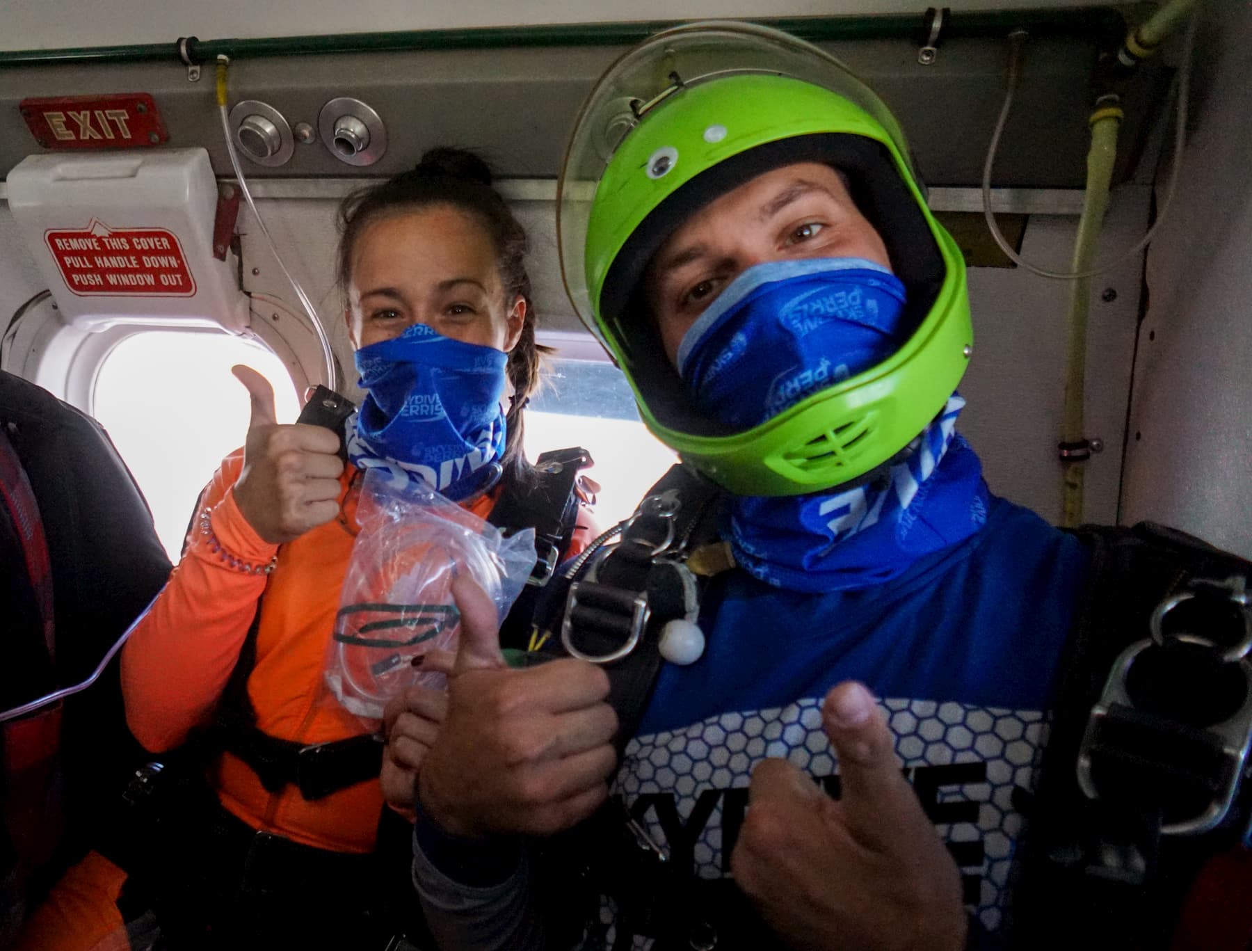 Two skydivers prepare for a jump.