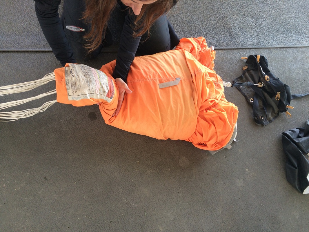 a jumper packing a parachute