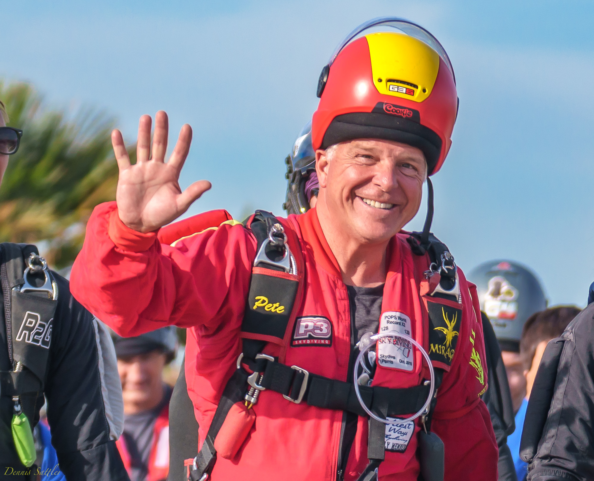 A jumper named Pete waves before boarding the skydiving aircraft.