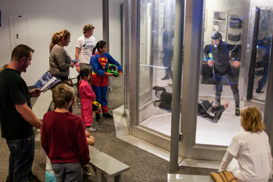 people watch experienced flyers in our skydiving simulator