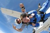 a tandem student exits from a Twin Otter at Skydive Perris near Los Angeles