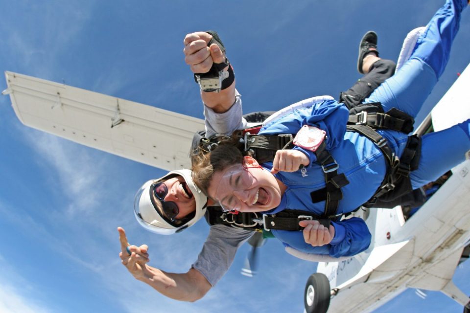 a tandem student exits from a Twin Otter at Skydive Perris near Los Angeles