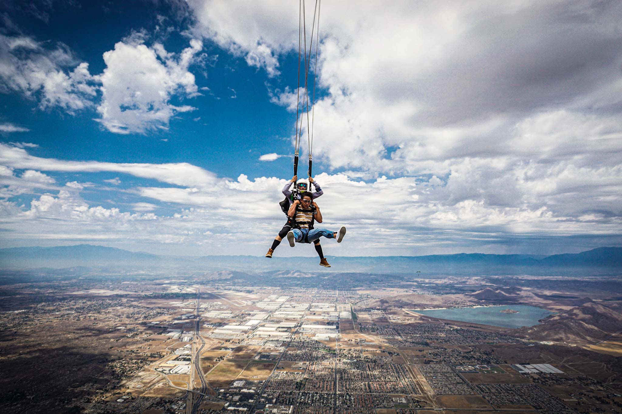 A tandem instructor and student brace as the parachute is deployed at 5,500 feet