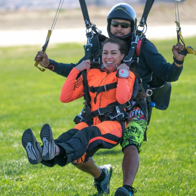 tandem skydivers coming in for landing