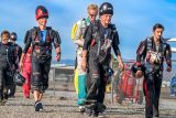 Jumpers walk to the aircraft in prep for a skydive.