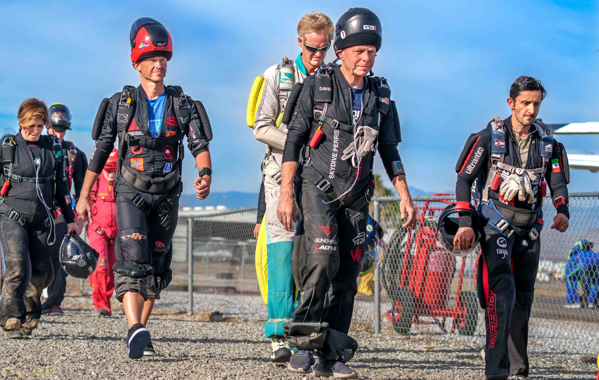 Jumpers walk to the aircraft in prep for a skydive.